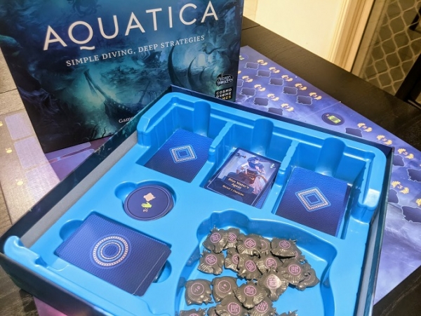 The insert for Aquatica is blue, the box art is blue, and the card backs are blue. It's all blue!